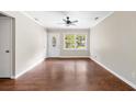 Spacious living room with hardwood floors, a ceiling fan, and a bright window view at 315 Elliott Dr, Ladson, SC 29456