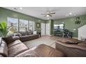 Cozy living room featuring hardwood floors, a ceiling fan, a large TV and comfortable couches at 326 Surfbird Rd # 388, Summerville, SC 29486