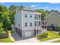 Attractive two-story home with double balconies, elevated design, and a convenient garage at 3751 Copahee Sound Dr, Mount Pleasant, SC 29466