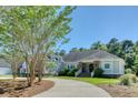 Charming front exterior with manicured lawn and inviting entryway at 3751 St Ellens Dr, Mount Pleasant, SC 29466