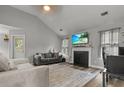 Comfortable living room with a decorative fireplace, and plush seating at 402 Equinox Cir, Ladson, SC 29456
