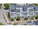 Beautiful townhome featuring modern design, balconies, and well-kept landscaping at 4404 Avery Ave, North Charleston, SC 29405