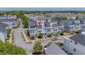 A modern townhome with gray siding, large windows, and a well-maintained front yard at 4404 Avery Ave, North Charleston, SC 29405