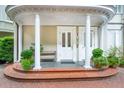 Charming front entrance featuring double doors, columns, and manicured greenery at 5 Legare St # C, Charleston, SC 29401