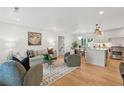Cozy living room featuring modern decor and an open flow to the kitchen, perfect for entertaining and everyday living at 521 Carpenter St, Charleston, SC 29412