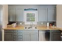 Well-lit kitchen showcasing butcher block countertops, modern fixtures, and a stainless steel dishwasher at 825 Savage Rd, Charleston, SC 29414