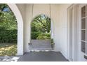 Relaxing porch swing offering a peaceful view of the lush surroundings and a sense of tranquility at 9 Wesley Dr, Charleston, SC 29407
