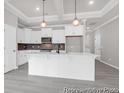 Well-designed kitchen with white cabinets, stainless steel appliances, and center island and pendant lighting at 1010 Toland Dr # 35, Saint George, SC 29477