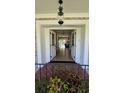 Welcoming entryway featuring double doors, a stylish light fixture, and a glimpse of the home's interior at 102 Ashborough Ave, Summerville, SC 29485