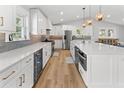 Beautiful kitchen featuring white cabinets, stainless steel appliances, large center island, and a beverage refrigerator at 1055 Royalist Rd, Mount Pleasant, SC 29464