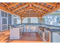 Covered outdoor kitchen includes stainless steel appliances, a sink, counter space, and a built-in bar at 110 Salinas Ct, Summerville, SC 29483