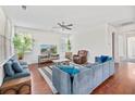 Spacious living room with hardwood floors, comfortable seating, and plenty of natural light through the windows at 111 Gavins Way, Goose Creek, SC 29445