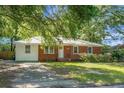Lovely brick and siding home with a well-maintained lawn and mature trees, providing a serene setting at 113 Owens Cir, Summerville, SC 29483
