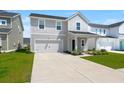 Beautiful exterior view of the two-story home featuring a garage and inviting curb appeal at 130 Spotted Way, Summerville, SC 29485