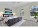 Bedroom featuring neutral walls and carpet, two large windows, and a king size bed at 1631 Camfield Ln, Mount Pleasant, SC 29466