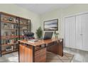 Home office with a large wooden desk, black leather chair, and ample storage space at 1631 Camfield Ln, Mount Pleasant, SC 29466