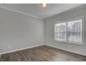 Well-lit bedroom featuring durable wood-look floors and neutral paint with large windows at 1671 Grange Cir, Summerville, SC 29486