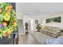 Inviting living room with hardwood floors, neutral paint, plush rug, and cozy sofa creates a warm and welcoming ambiance at 1816 Mepkin Rd # B1, Charleston, SC 29407
