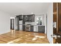 Bright, fully equipped kitchen with stainless steel appliances, a modern stove, and dark cabinetry at 19 Smith St # C, Charleston, SC 29401
