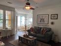 Cozy living room featuring ceiling fan, modern decor, and comfortable seating at 1928 Chatelain Way, Mount Pleasant, SC 29464