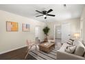 Cozy living room with hardwood floors, a ceiling fan, neutral-colored walls, and stylish furniture at 205 Owens Dr, Summerville, SC 29485