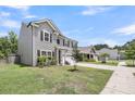 Charming two-story home featuring a two-car garage, well-maintained lawn, and attractive landscaping at 2109 Rowan Rd, Johns Island, SC 29455