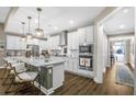 Modern kitchen featuring stainless steel appliances, granite countertops, and ample cabinet space at 218 River Martin Ct, Summerville, SC 29483