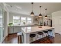 Modern kitchen with a large center island, stainless steel appliances, and pendant lighting at 5525 Alpine Dr, Summerville, SC 29483