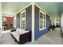 Cozy front porch seating area, perfect for relaxing with its comfortable sofa and view of the lovely neighborhood at 601 King Haven Ln, Johns Island, SC 29455