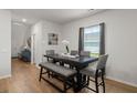Well-lit dining room with a modern table set, stylish decor, and a bright window view at 630 Jancus St, Charleston, SC 29414