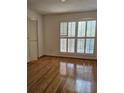 Bright bedroom features hardwood floors, plantation shutters, and ample natural light at 70 Legare St, Charleston, SC 29401