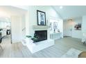 Bright living area with fireplace, seamlessly connects to the modern kitchen, with easy access to the entrance at 10 Bayshore Blvd, Goose Creek, SC 29445
