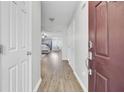 Bright entryway featuring wood-look floors, a view into the living spaces, and ample closet space at 108 Larkspur Dr, Goose Creek, SC 29445