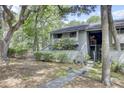 Inviting condo with landscaped front yard and easy access with the exterior stairs at 1208 Village Creek Ln Ln # 1, Mount Pleasant, SC 29464