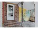 Enclosed side porch, with painted mural, accessible from the exterior at 1263 N Highway 52, Moncks Corner, SC 29461