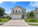 Charming two-story home with a two-car garage, manicured lawn, and a welcoming front porch seating area at 160 Brookhaven Rd, Summerville, SC 29486