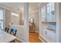 Elegant entryway with hardwood floors, stylish decor, and a built-in display cabinet at 1852 Pierce St, Charleston, SC 29492