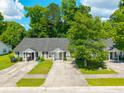 Aerial view of a well-maintained home surrounded by mature trees at 207 Allen Richard Ct # B, Moncks Corner, SC 29461
