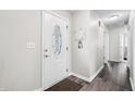Inviting entryway featuring a decorative door with a glass window and wood-look flooring at 2233 Glendale Dr, Charleston, SC 29414