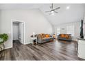 Bright living room featuring vaulted ceilings, a ceiling fan, and modern flooring and neutral decor at 2233 Glendale Dr, Charleston, SC 29414