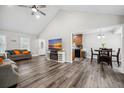 Open-concept living room with vaulted ceilings that connects the kitchen and dining area at 2233 Glendale Dr, Charleston, SC 29414