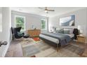 Bright bedroom with modern decor, large windows, and a comfortable bed at 250 Huguenot Trl, Huger, SC 29450