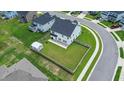 Aerial view of a spacious backyard with privacy fence, shed, patio, and surrounding neighborhood at 277 Fiddleback Dr, Summerville, SC 29486