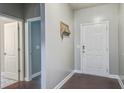 Inviting entryway featuring hardwood floors and a charming key holder, offering a warm welcome at 3639 Pimmit Pl, Ladson, SC 29456