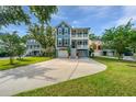 Charming home with a double porch, large driveway, garage, and well-manicured lawn at 3711 Tip Ln, Mount Pleasant, SC 29466