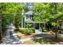 Charming two-story home with manicured landscaping, a detached garage and a tree-lined yard at 5032 Coral Reef Dr, Johns Island, SC 29455