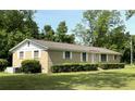 Well-kept single-story brick home with manicured shrubs and a spacious front yard at 6287 Sniders Hwy, Walterboro, SC 29488