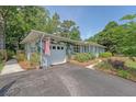 Exterior angle of a lovely home, featuring an attached garage and neatly landscaped yard at 803 Burnett Dr, Charleston, SC 29412
