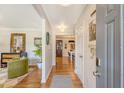 Inviting foyer with hardwood floors, stylish decor, and a view into the living and dining areas at 803 Burnett Dr, Charleston, SC 29412