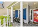 Charming front porch featuring comfortable seating, decorative shutters, and a welcoming entrance at 1007 Whitlow Blvd, Summerville, SC 29483